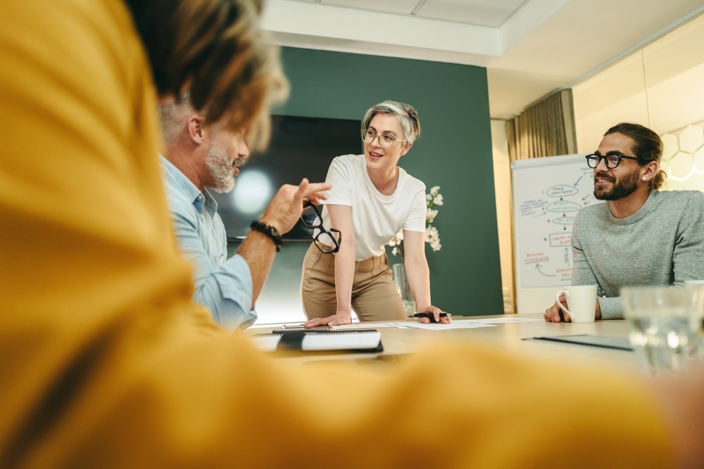 Happy business people having a discussion in a boardroom